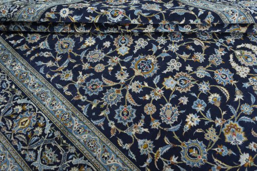 Close-up detail of 2000s Kashan rug from Iran / Persia showing Wool weave