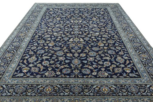 Surface texture of 2000s Kashan rug with natural Wool and intricate pattern