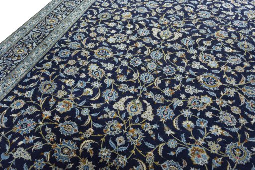 Backside of handmade 2000s Kashan rug showing knot structure and weave density