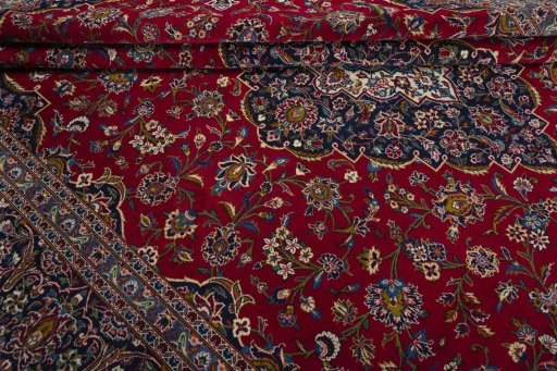 Close-up detail of 2000s Kashan rug from Iran / Persia showing Wool weave
