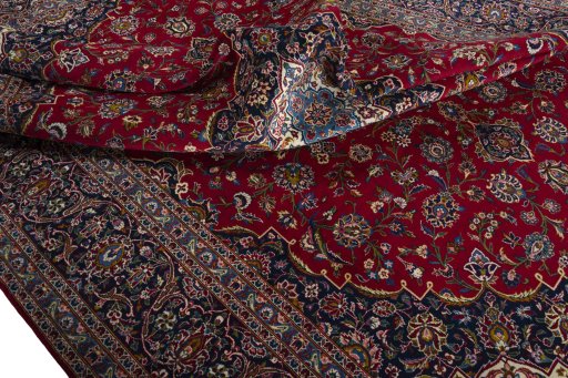 Surface texture of 2000s Kashan rug with natural Wool and intricate pattern