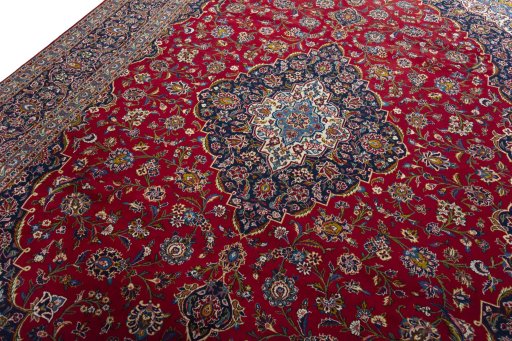 Backside of handmade 2000s Kashan rug showing knot structure and weave density