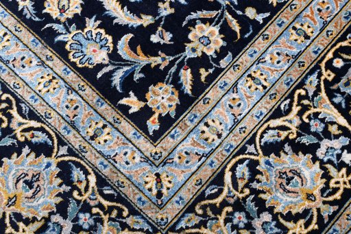 Close-up detail of 2000s Kashan rug from Iran / Persia showing Wool weave