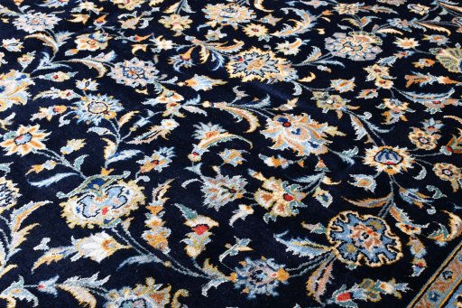 Surface texture of 2000s Kashan rug with natural Wool and intricate pattern