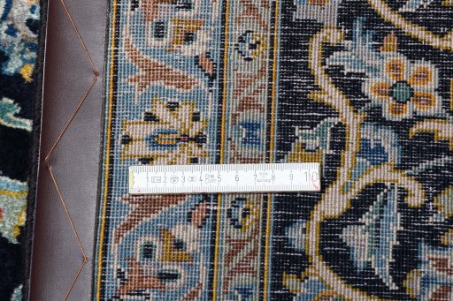 Close-up detail of 2000s Kashan rug from Iran / Persia showing Wool weave