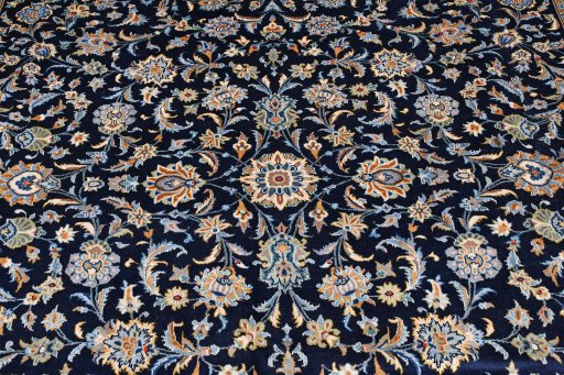Close-up detail of 2000s Kashan rug from Iran / Persia showing Wool weave