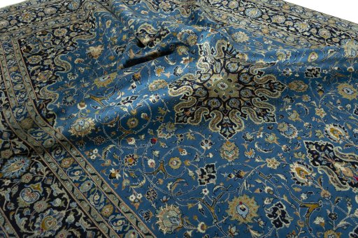 Surface texture of 2000s Kashan rug with natural Wool and intricate pattern