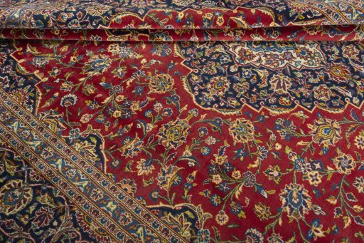 Close-up detail of 2000s Kashan rug from Iran / Persia showing Wool weave