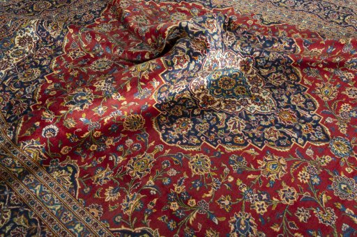 Surface texture of 2000s Kashan rug with natural Wool and intricate pattern