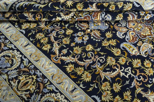 Close-up detail of 2000s Kashan rug from Iran / Persia showing Wool weave