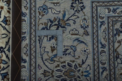 Backside of handmade 2000s Kashan rug showing knot structure and weave density
