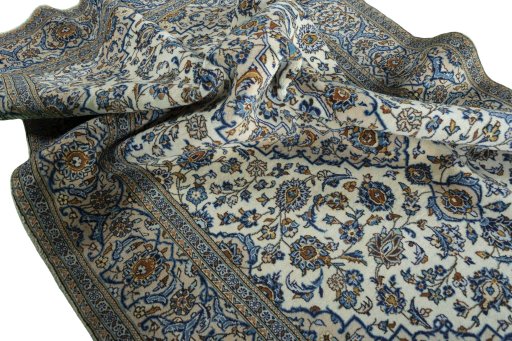 Surface texture of 2000s Kashan rug with natural Wool and intricate pattern
