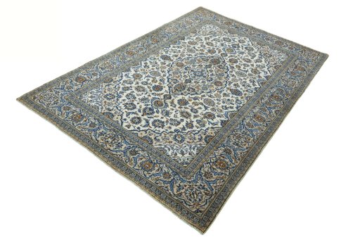 Corner detail of 2000s Kashan rug showing border pattern and Wool pile