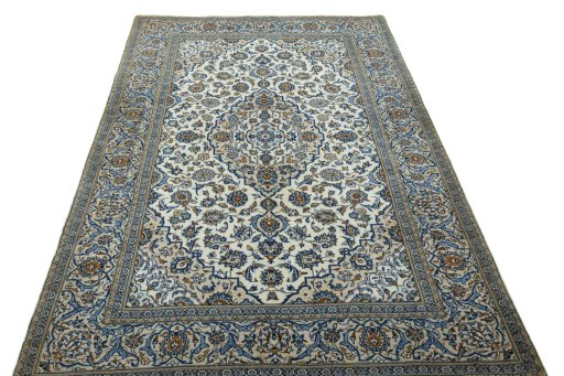 Surface texture of 2000s Kashan rug with natural Wool and intricate pattern