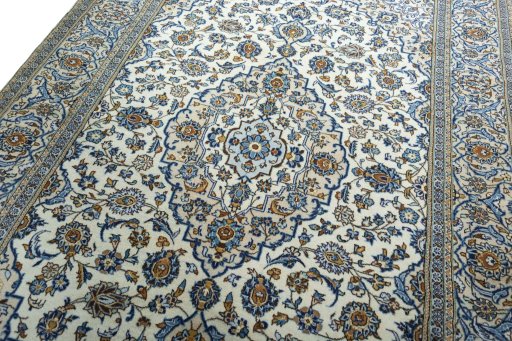 Backside of handmade 2000s Kashan rug showing knot structure and weave density