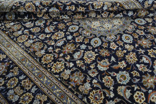 Close-up detail of 2000s Kashan rug from Iran / Persia showing Wool weave