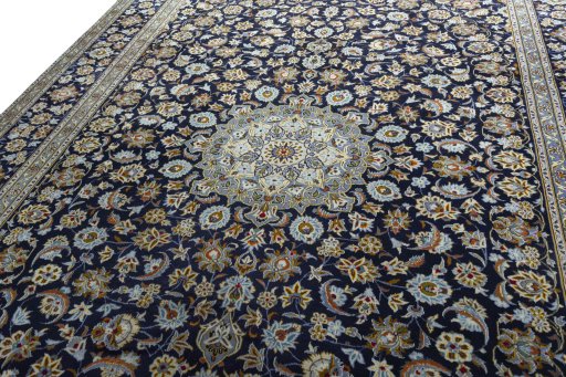 Backside of handmade 2000s Kashan rug showing knot structure and weave density