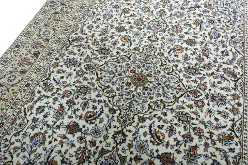 Backside of handmade 2000s Kashan rug showing knot structure and weave density