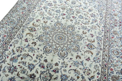 Backside of handmade 2000s Kashan rug showing knot structure and weave density