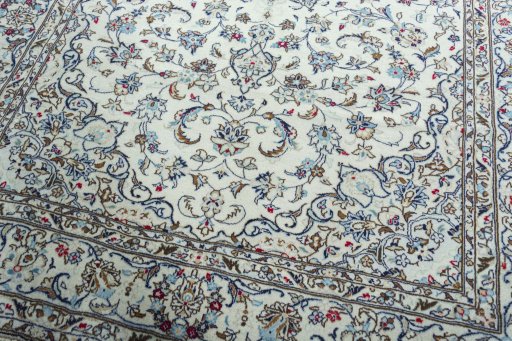 Close-up detail of 2000s Kashan rug from Iran / Persia showing Wool weave