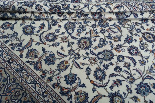 Close-up detail of 2000s Kashan rug from Iran / Persia showing Wool weave