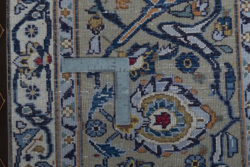 Backside of handmade 2000s Kashan rug showing knot structure and weave density