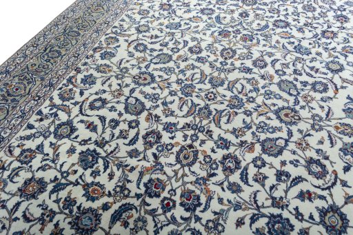 Backside of handmade 2000s Kashan rug showing knot structure and weave density