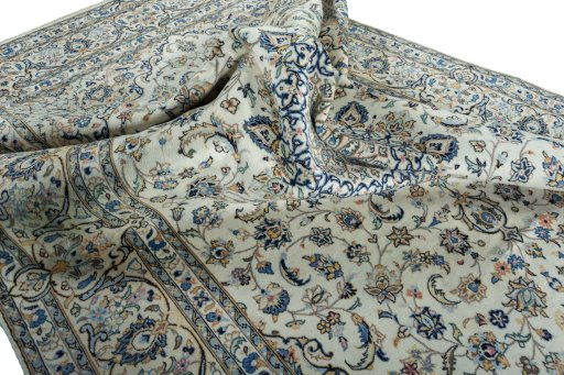 Surface texture of 2000s Kashan rug with natural Wool and intricate pattern