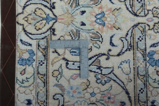 Backside of handmade 2000s Kashan rug showing knot structure and weave density
