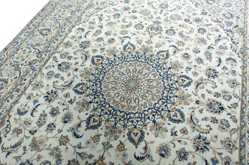 Backside of handmade 2000s Kashan rug showing knot structure and weave density