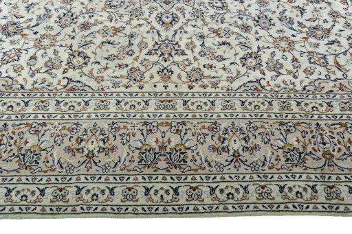 Corner detail of 2000s Kashan rug showing border pattern and Wool pile