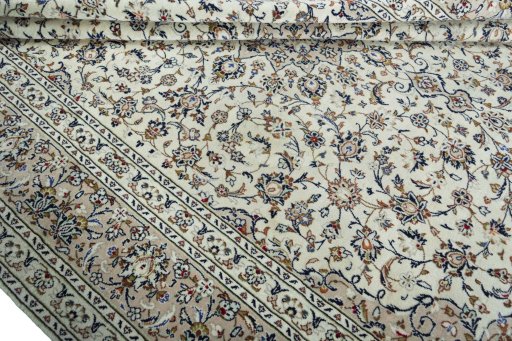 Close-up detail of 2000s Kashan rug from Iran / Persia showing Wool weave