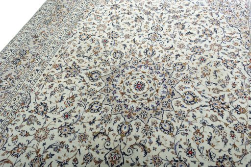 Backside of handmade 2000s Kashan rug showing knot structure and weave density