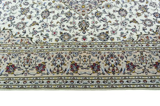Corner detail of 2000s Kashan rug showing border pattern and Wool pile
