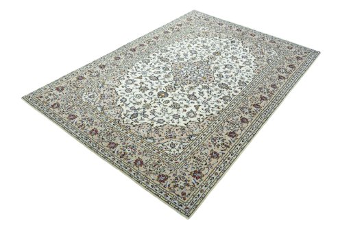 Corner detail of 2000s Kashan rug showing border pattern and Wool pile