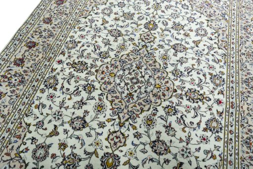 Backside of handmade 2000s Kashan rug showing knot structure and weave density