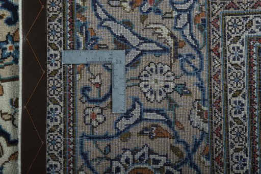 Backside of handmade 2000s Kashan rug showing knot structure and weave density