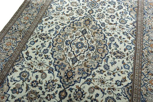 Backside of handmade 2000s Kashan rug showing knot structure and weave density