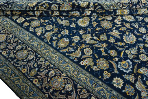 Close-up detail of 2000s Kashan rug from Iran / Persia showing Wool weave