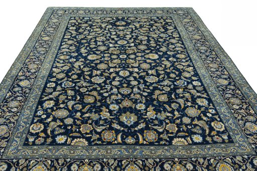 Surface texture of 2000s Kashan rug with natural Wool and intricate pattern