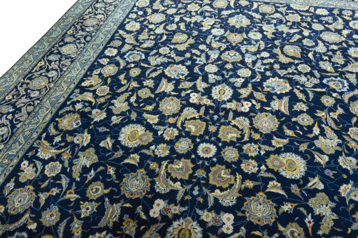 Backside of handmade 2000s Kashan rug showing knot structure and weave density