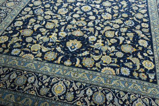 Close-up detail of 2000s Kashan rug from Iran / Persia showing Wool weave