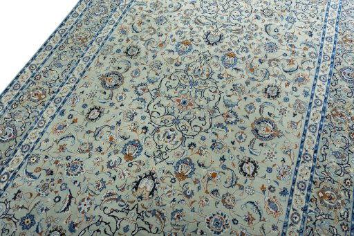 Backside of handmade 2000s Kashan rug showing knot structure and weave density