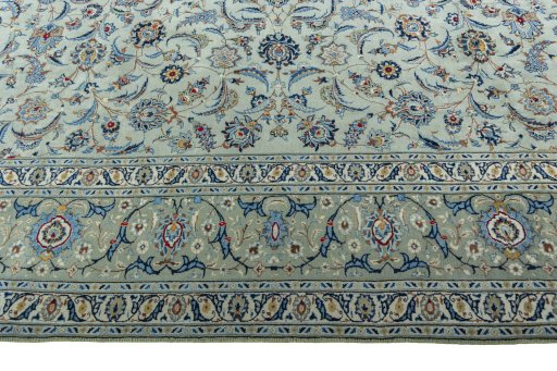 Corner detail of 2000s Kashan rug showing border pattern and Wool pile