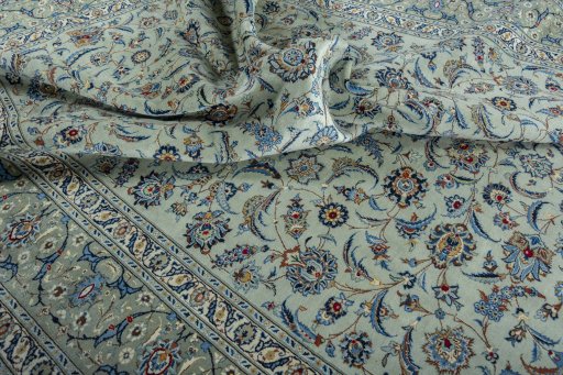 Surface texture of 2000s Kashan rug with natural Wool and intricate pattern