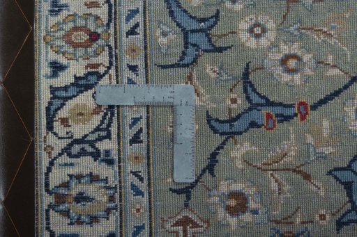 Backside of handmade 2000s Kashan rug showing knot structure and weave density