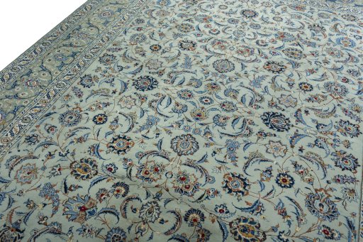 Backside of handmade 2000s Kashan rug showing knot structure and weave density