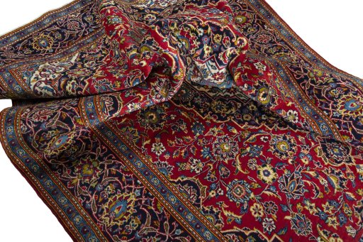 Surface texture of 2000s Kashan rug with natural Wool and intricate pattern