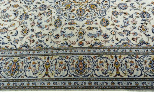 Corner detail of New Kashan rug showing border pattern and Wool pile