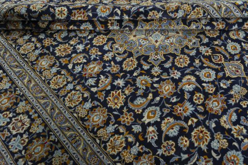 Close-up detail of 2000s Kashan rug from Iran / Persia showing Wool weave